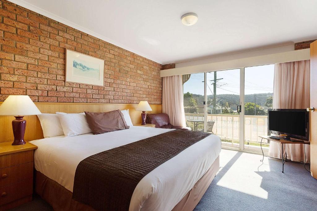 King Room with a generous king bed and private balcony