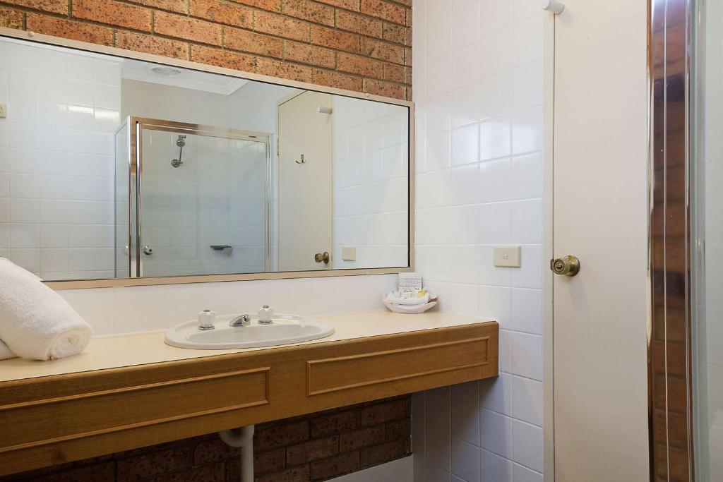 Clean private ensuite bathroom with walk-in shower and vanity